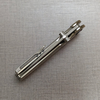 VORIXN Ocean Mirage folding knife closed, angled view with blade spine facing upward