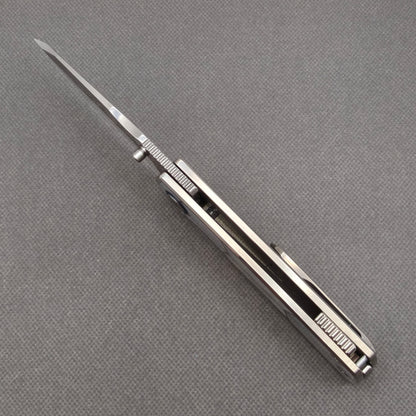 VORIXN KB063 open spine-side structure showing blade alignment and pearl inlaid handle thickness.