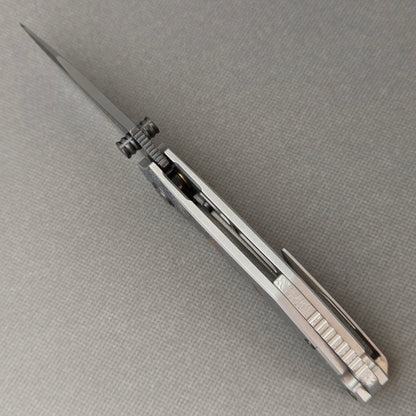 VORIXN Yokai KB106 Folding Knife – open spine side structure showing blade alignment and Laser-Engraved Titanium handle thickness