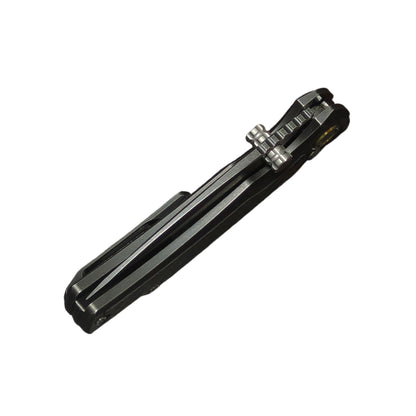 7. VORIXN KB077 folding knife closed angled view with blade spine on top black PVD titanium finish