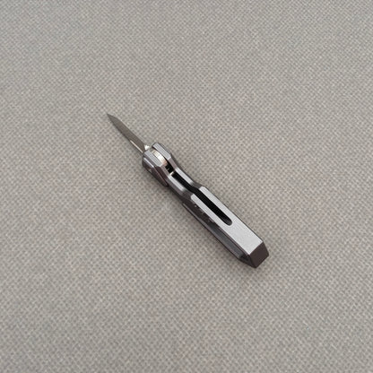 VORIXN NA005 Super Tiny Folding Knife – partially open view showing flipper and pivot mechanism