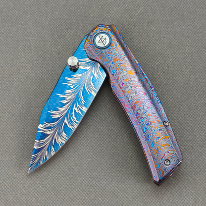 Vorixn "Aurora Bright" Flipper & Thumb Stud Knife Hand-Flamed Zirconium Handle (3.8" Feather Damascus Blade) KB110