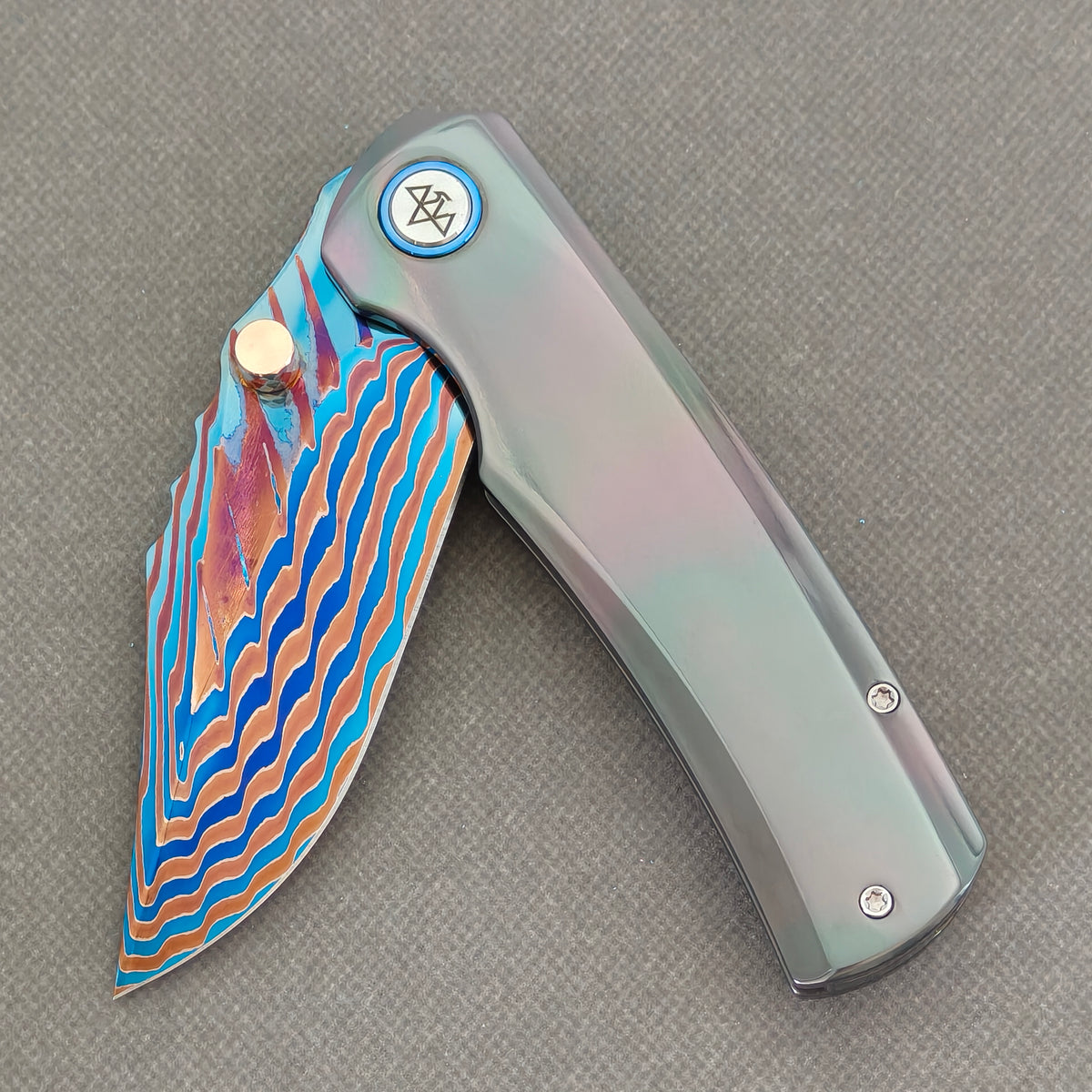 VORIXN Steelwraith KB143 Folding Knife – partially open EDC view showing flipper, thumb stud, pivot, and Zirconium handle profile.