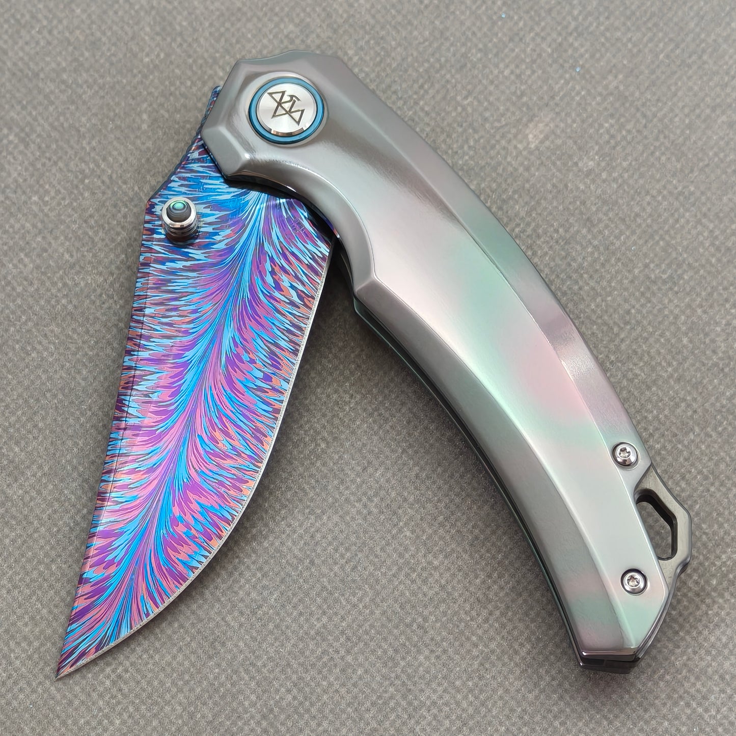 VORIXN PrismWake KB137 Folding Knife – partially open EDC view showing flipper, thumb stud, pivot, and Zirconium handle profile.