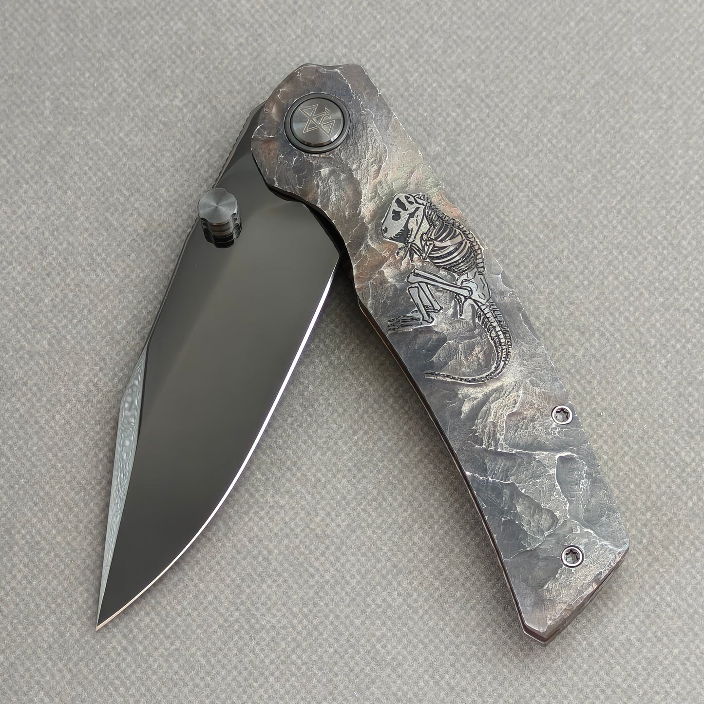VORIXN Rex KB119 Folding Knife – partially open EDC view showing flipper, thumb stud, pivot, and hand-engraved titanium handle profile