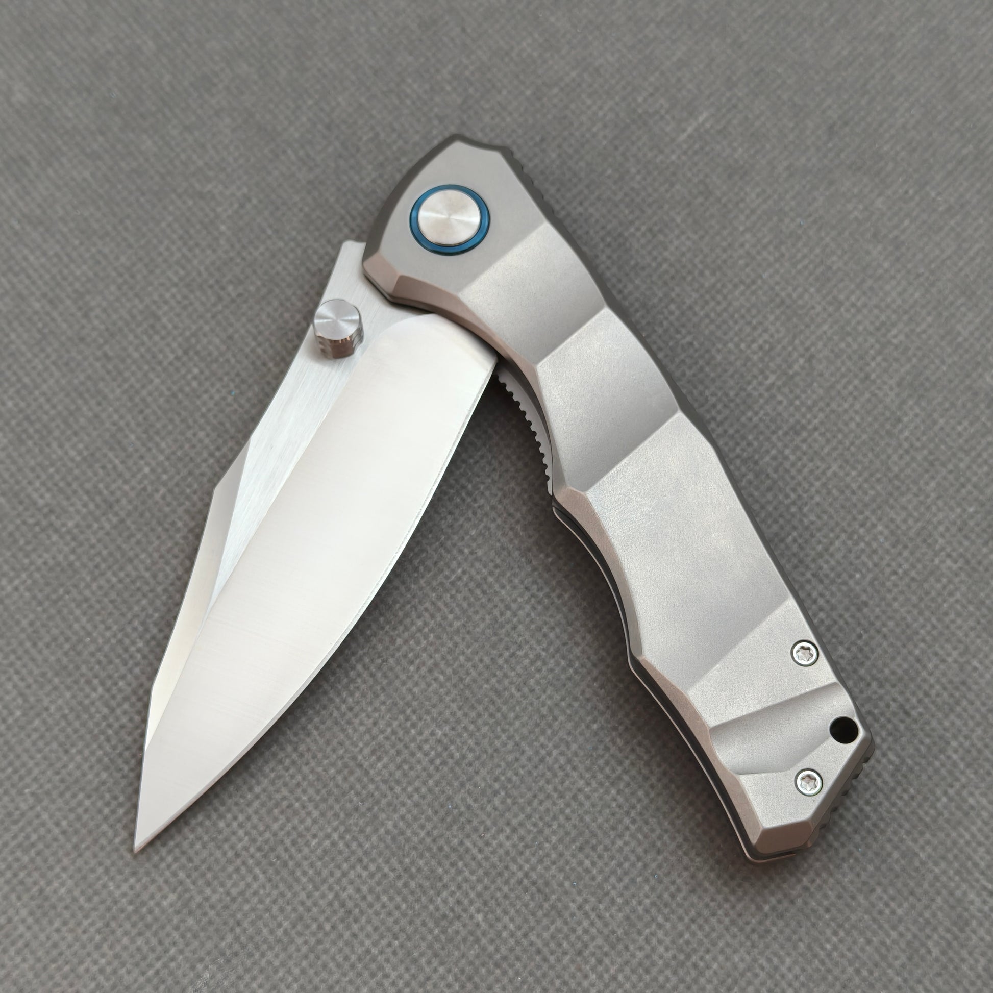 VORIXN KB014 partially open EDC folding knife showing flipper, ceramic bearing pivot, and handle profile.