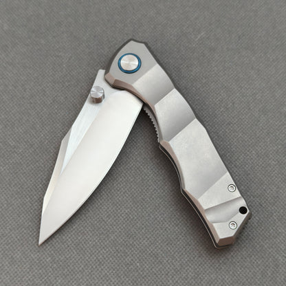 VORIXN KB014 partially open EDC folding knife showing flipper, ceramic bearing pivot, and handle profile.