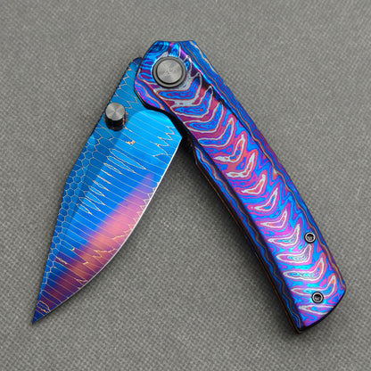 Vorixn "Celestial Current" Flipper & Thumb Stud Knife Hand-Flamed Zirconium Handle (3.8" Damascus Blade) KB099