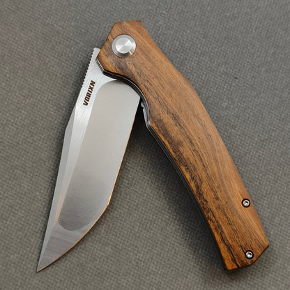 VORIXN KA013 Folding Knife – partially open EDC view showing flipper, thumb stud, pivot, and Golden Sandalwood handle profile