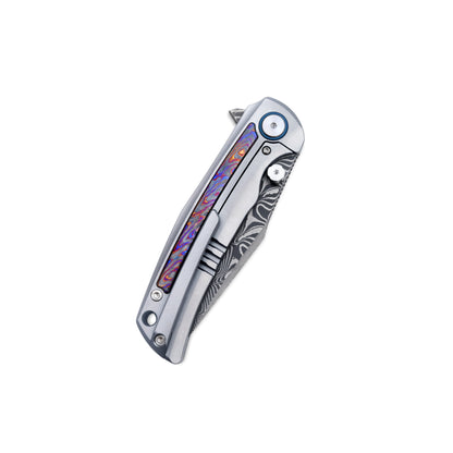 VORIXN Nebula knife closed, clip side view with titanium frame and colorful zirconium inlay artwork.