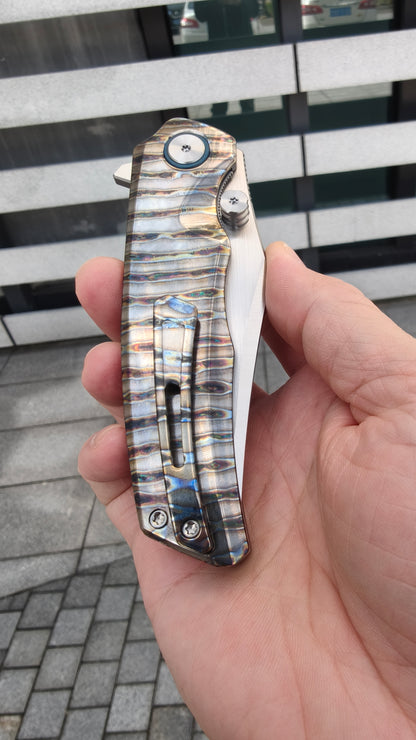 VORIXN KB035 folding knife closed, full view of handle pattern, clip side