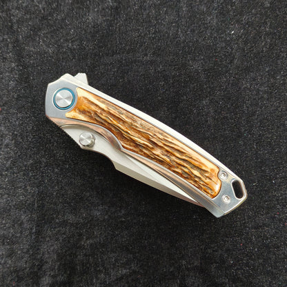 VORIXN AURON folding knife closed, show side with natural stag inlay pattern and full knife profile