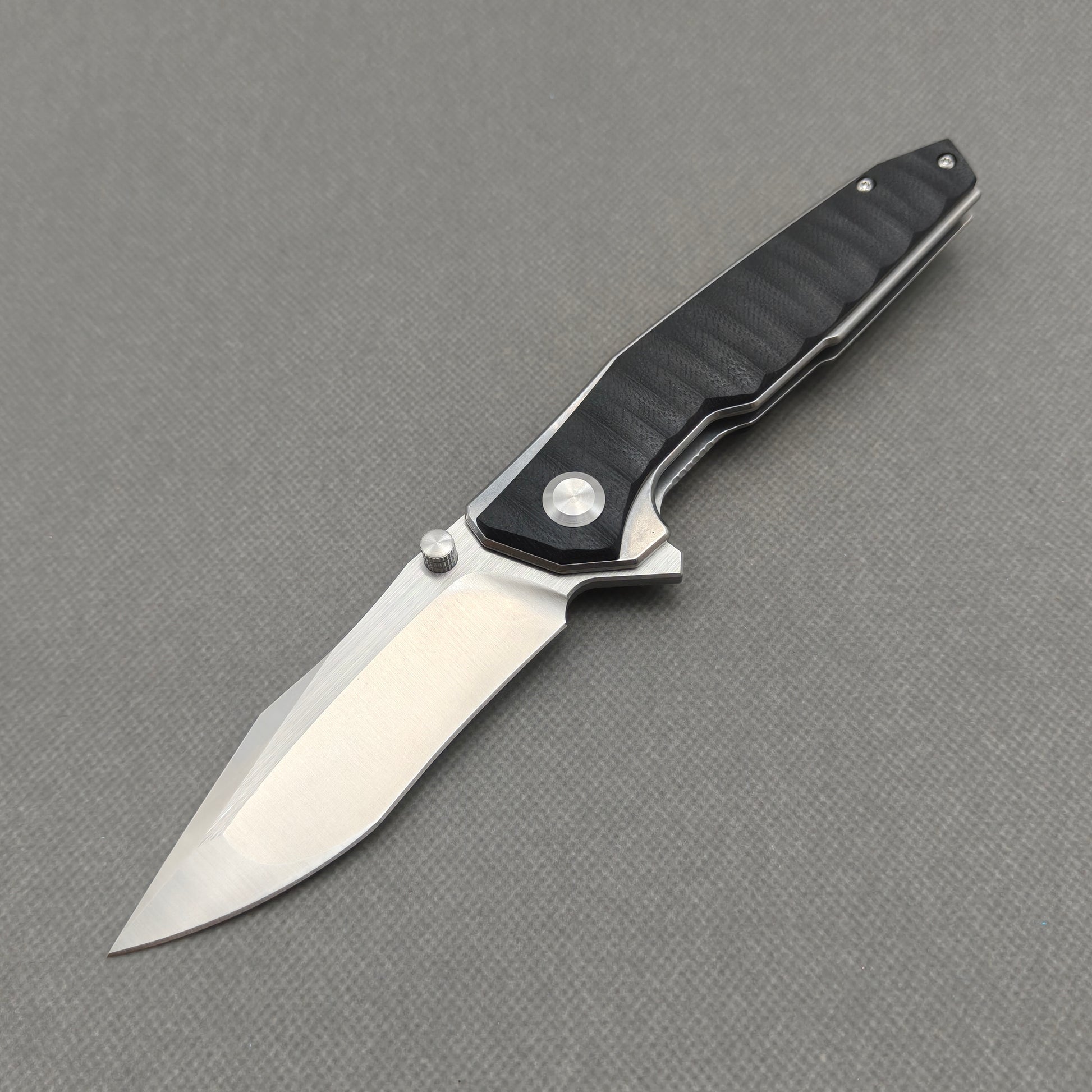 VORIXN KA008 9Cr13 stainless steel and black G10 folding knife open non-clip side view with blade, handle, and overall profile.