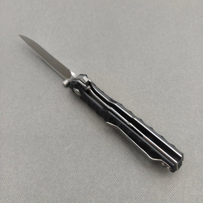 VORIXN KA008 closed clip-side view with pocket clip, screws, and G10 handle back.