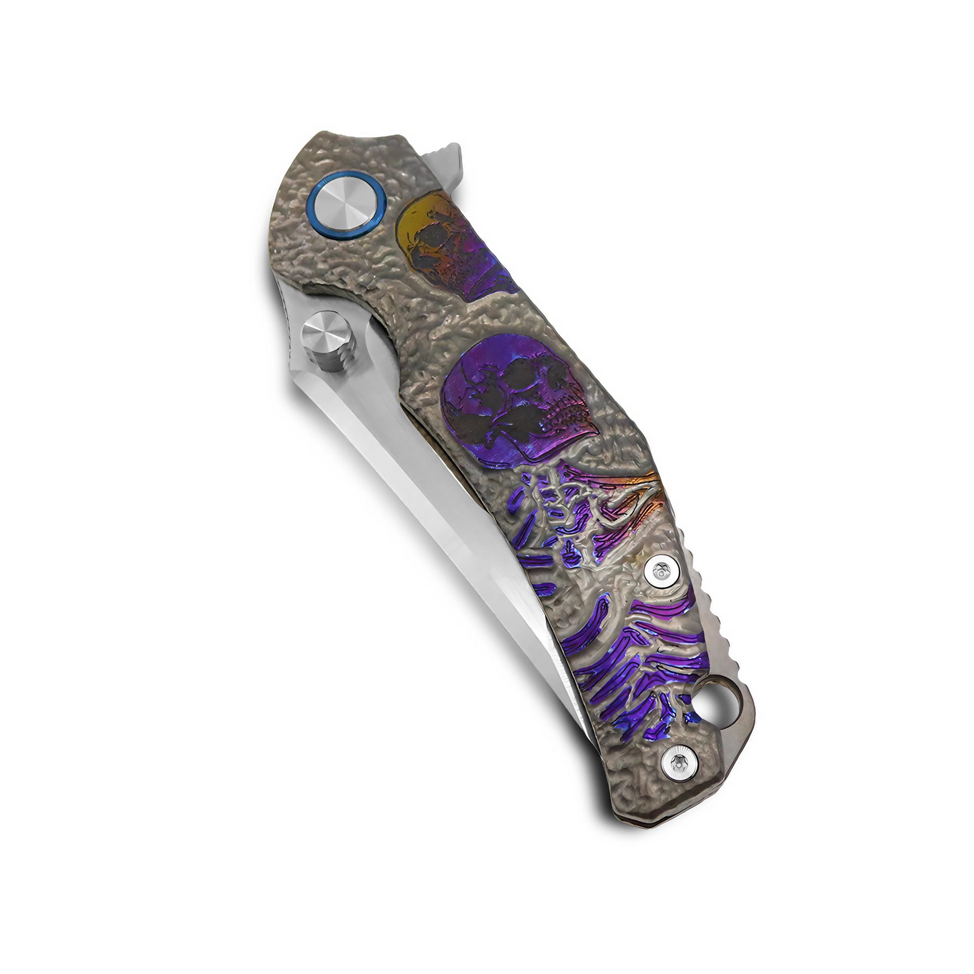 Detailed view of hand-carved titanium handle with skull motif and gradient anodized finish on VORIXN Eclipse folding knife