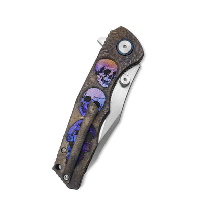Folded VORIXN Skull Titanium knife showing pocket clip side