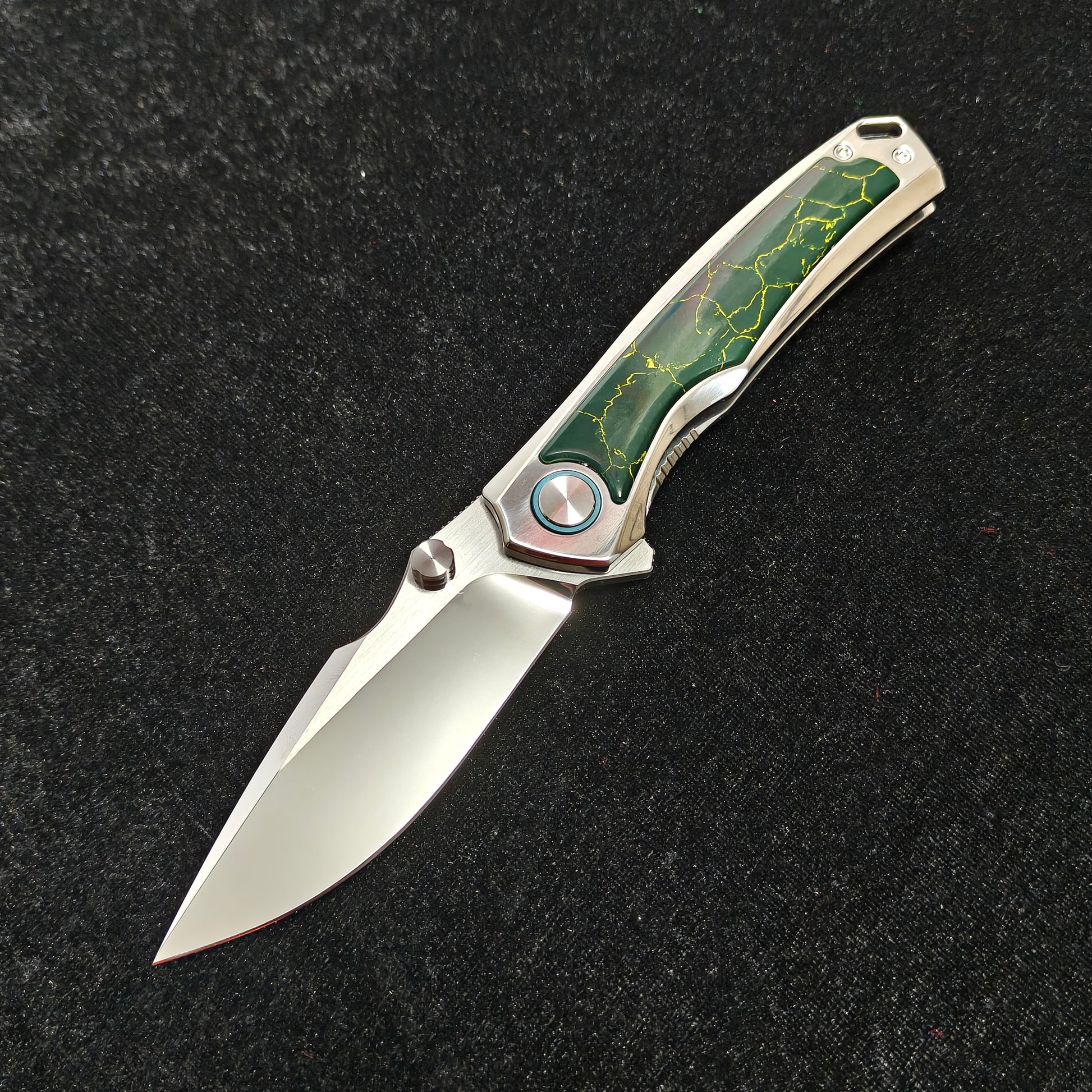 VORIXN Verdant folding knife open non-clip side with VG10 blade angled down, blade mirror-polished